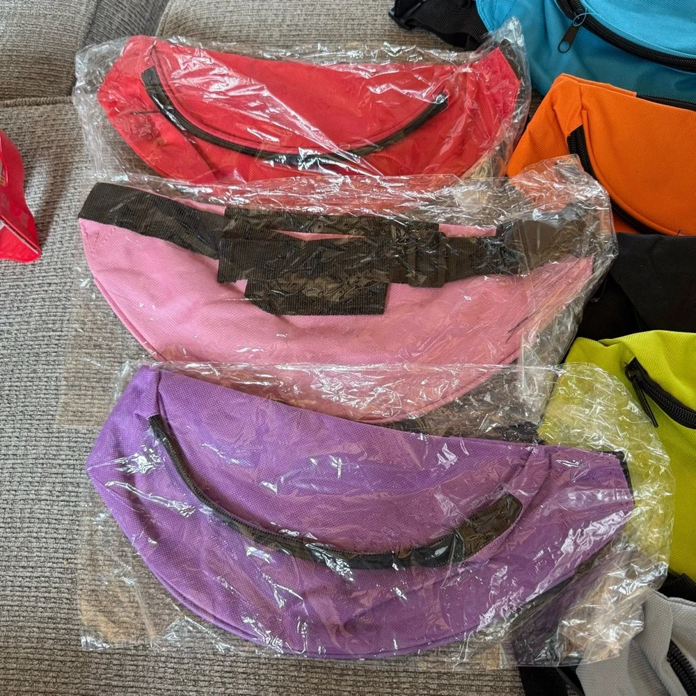 8 New or like new fanny packs in multiple colors